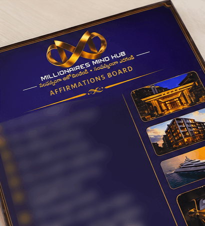A close-up angled view of a glossy dark blue brochure or booklet cover with gold trim, featuring the text 'Millionaires Mind Hub' and 'Affirmations Board,' plus small inset photos of luxurious buildings and a yacht.