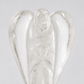 A clear glass angel figurine with detailed wings and a carved face, shown against a neutral light gray background.