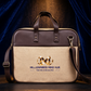 Beige and brown briefcase with 'Millionaires Mind Hub' logo on a dark background