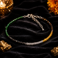 Necklace with multicolored beads on a black velvet surface with decorative elements.