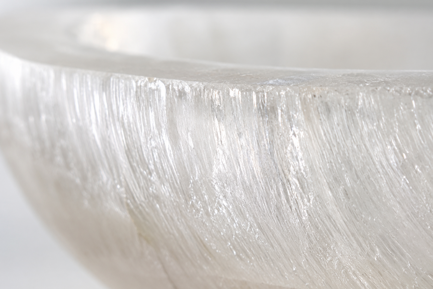 Close-up of a textured white surface with a light reflection