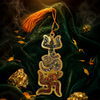 Decorative hanging ornament with intricate designs on a dark green fabric background.