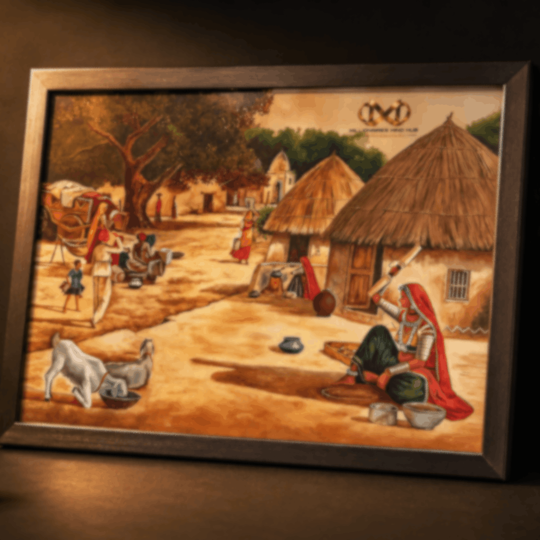Framed artwork depicting a village scene with people and animals, illuminated by a candle.
