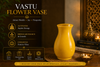 Yellow vase on a wooden surface with Vastu information text on a dark background