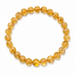 Yellow beaded bracelet on a white background