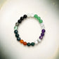 Multicolored beaded bracelet on a light gray background