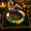 Colorful crystal bracelet on a green cushion with mystical background